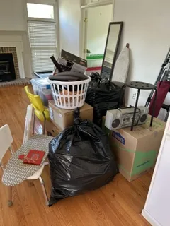 Living room filled with belongings before an estate cleanout