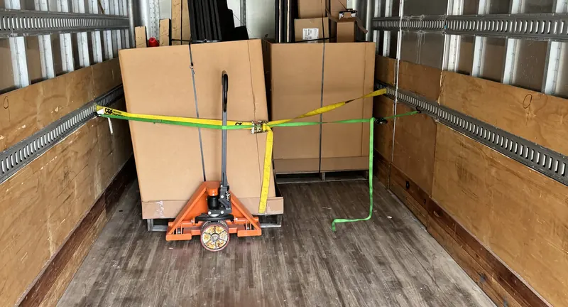 Freight secured inside a Quest box truck