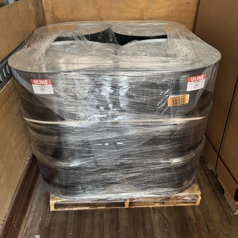 Shrink-wrapped palletized freight in a box truck