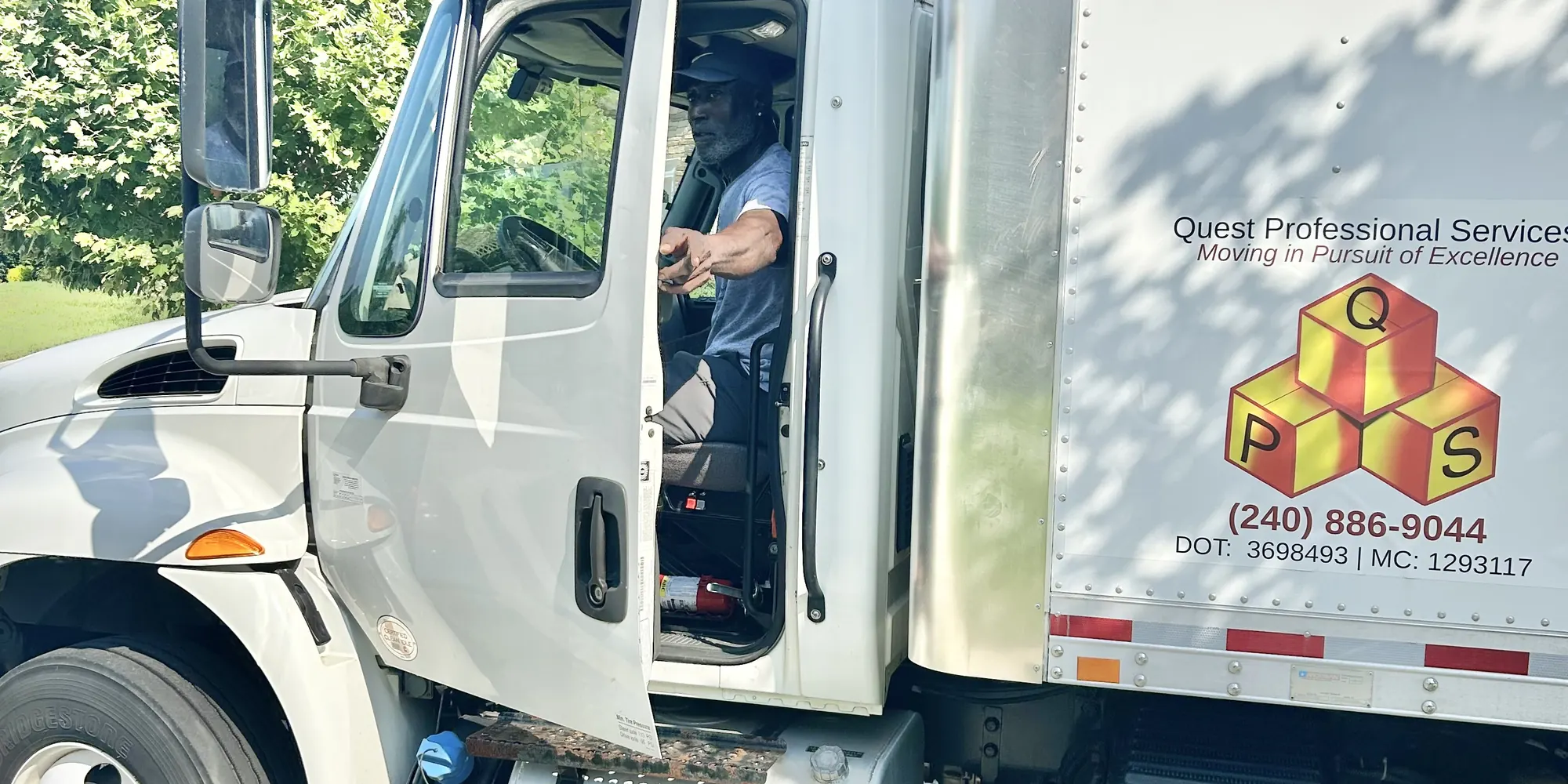 Quest driver in a box truck marked with USDOT 3698493 and MC 1293117